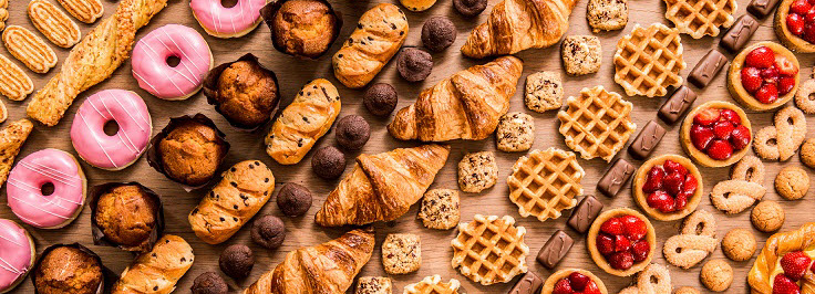 Table full of baked items and pastries