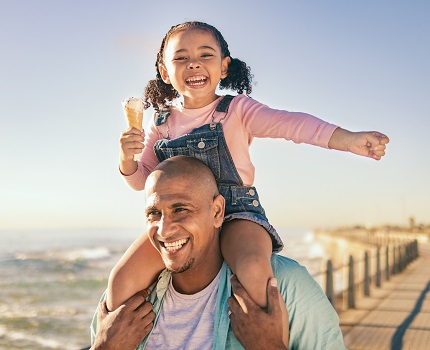 Father and daughter eating ice cream