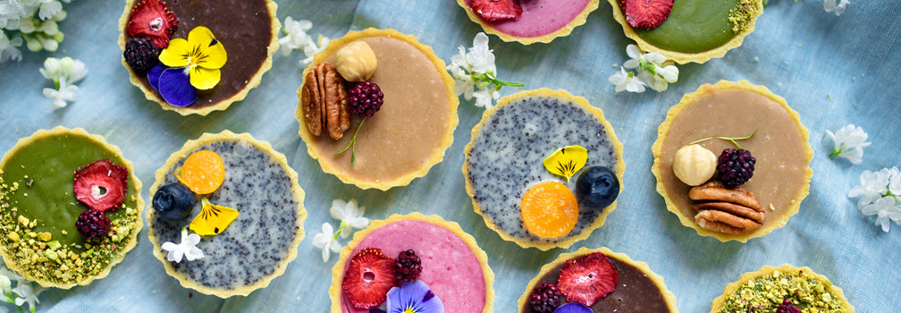 Table with variety of colorful pastries