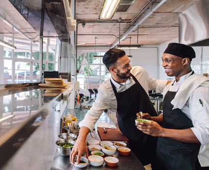 chefs working together in kitchen