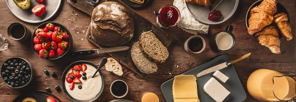 Breakfast table filled with food