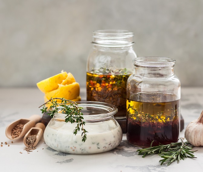 Jars with dressings and sauces