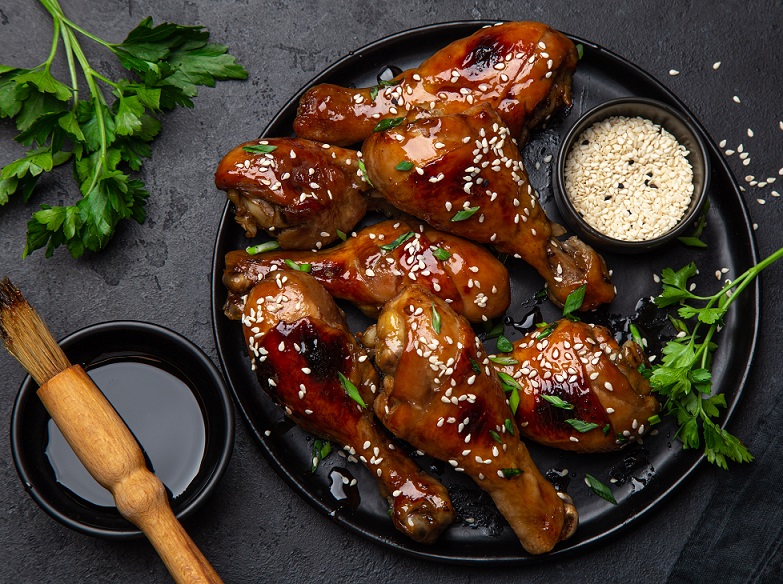 Plate with sticky marinated chicken
