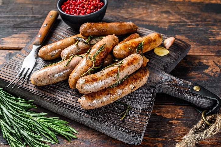 Pile of sausages on a serving board
