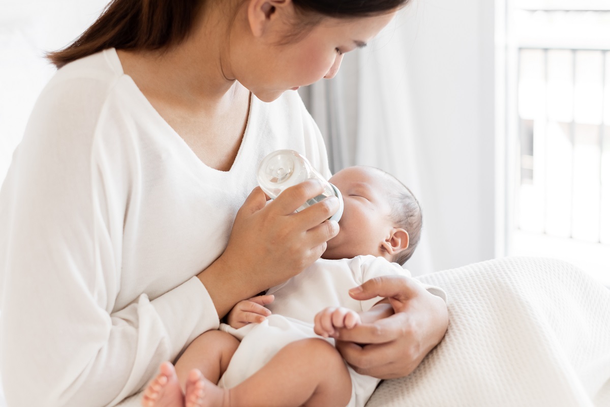 Mother feeding baby bottle
