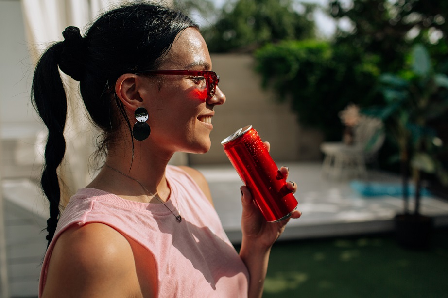Girl drinking drink from can