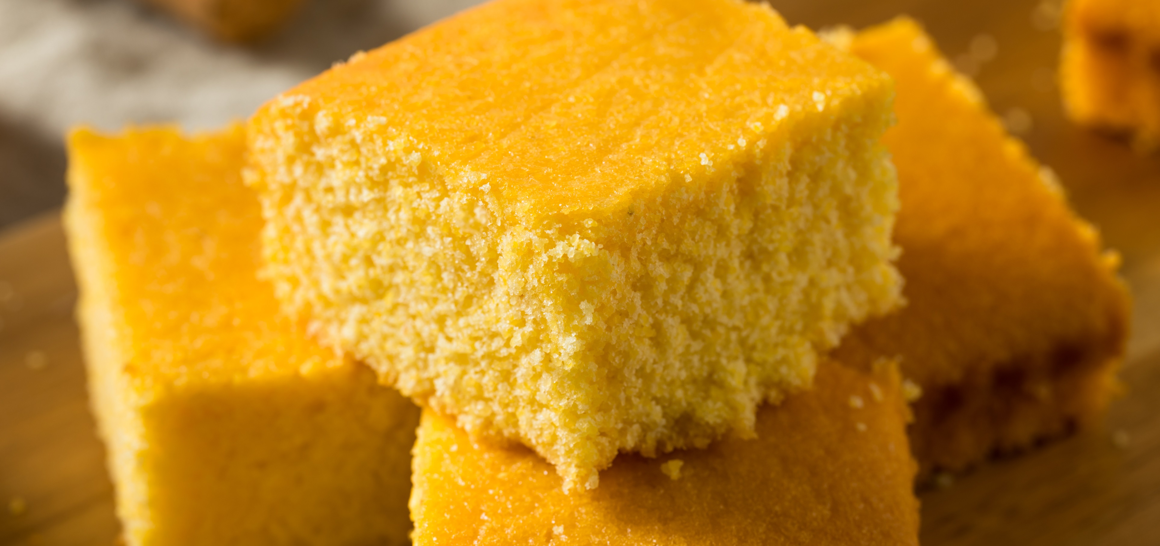 Corn bread slices on wooden platter