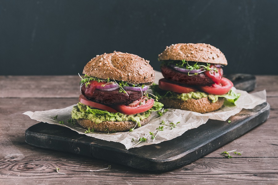 Plant-based burgers on a serving board
