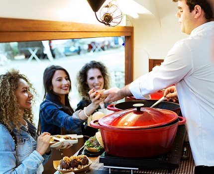 Women getting food at food truck