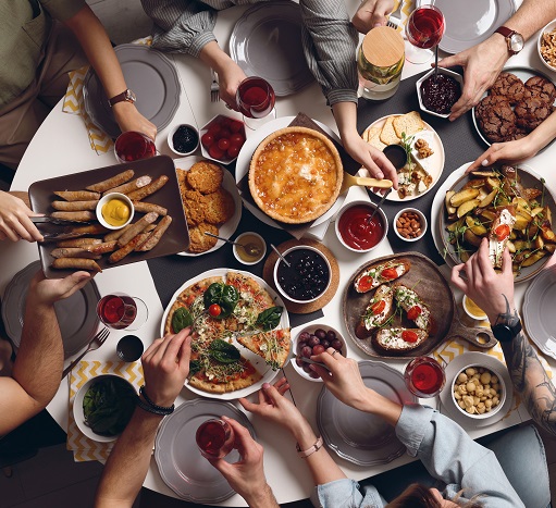People at table with plant-based brunch