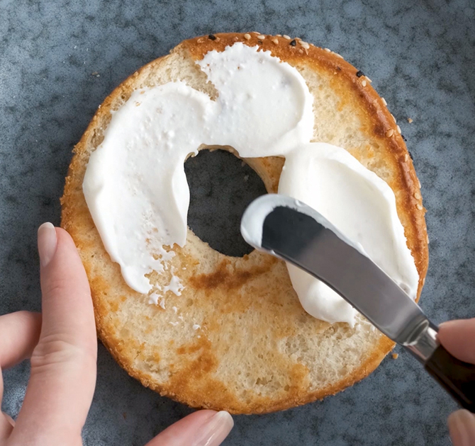 Spreading Cream Cheese on a Bagel